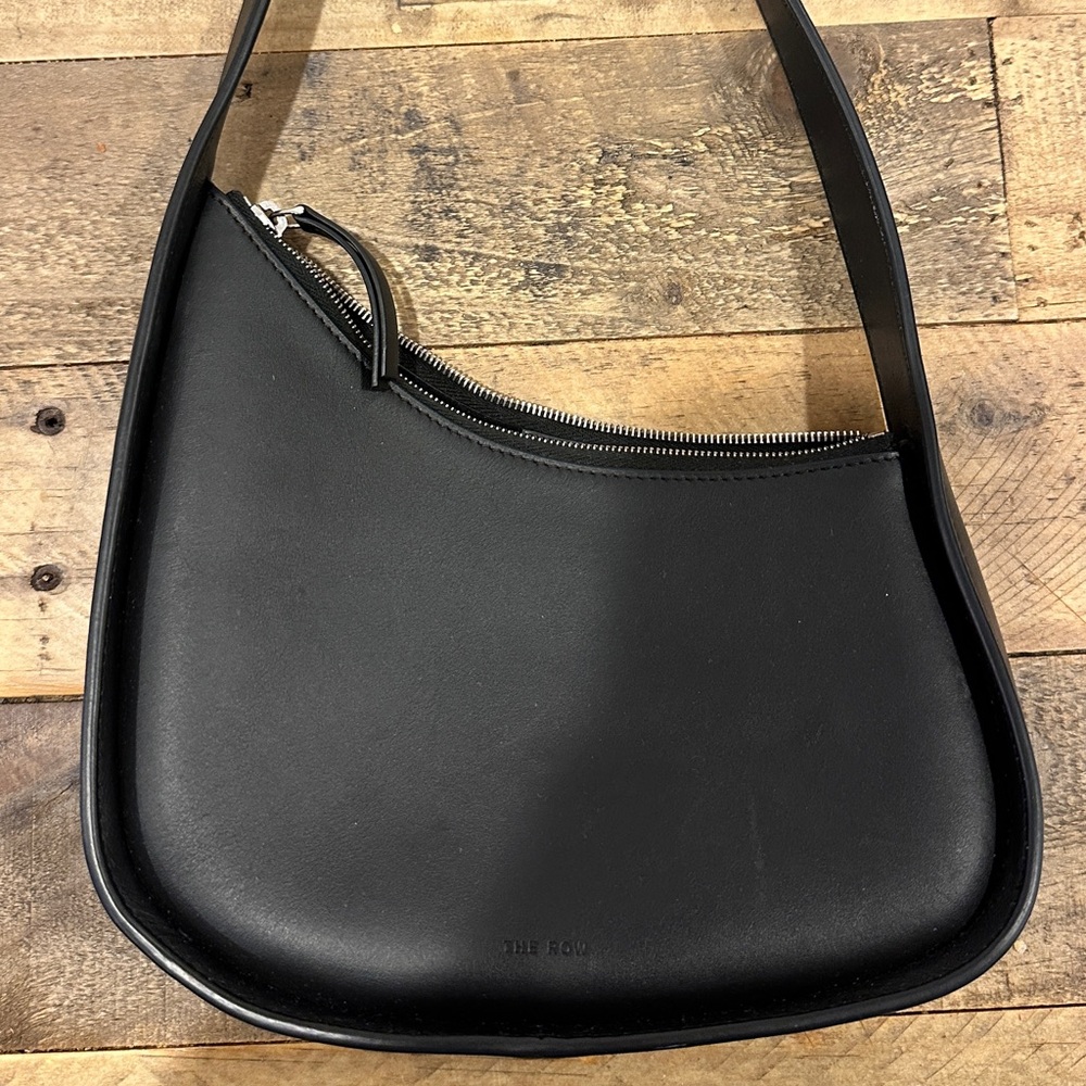 The Row Half Moon Bag in black calfskin